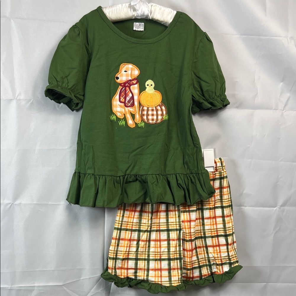 Green short matching set with dog and pumpkin appliqué and plaid ruffle shorts